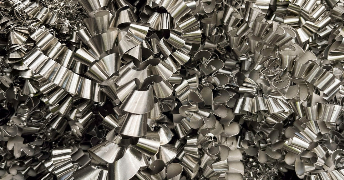 A large number of Inconel metal shavings in the shape of spirals. They are all piled on top of one another.